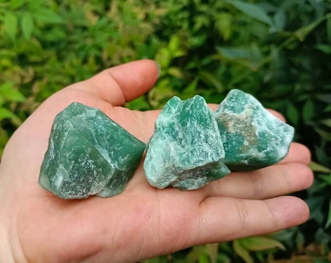 Image titled Rockhound holding a piece of green aventurine in the field